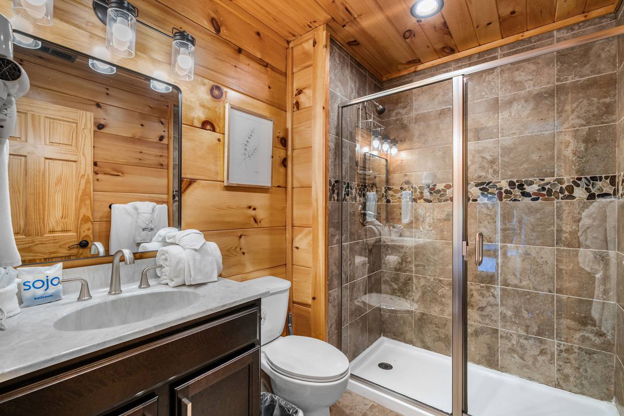 Jack-n-Jill bath with walk-in shower off game room & bunks Jack-n-Jill bath with walk-in shower off game room & bunks