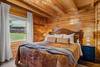 Main-level king bedroom with plush bedding Main-level king bedroom with plush bedding