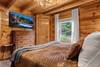 Main-level king bedroom with plush bedding Main-level king bedroom with plush bedding