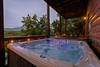 Relaxing 6-person hot tub with scenic backdrop Relaxing 6-person hot tub with scenic backdrop