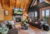 Cozy living room with fireplace, TV, & unforgettable views Cozy living room with fireplace, TV, & unforgettable views
