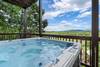 Relaxing 6-person hot tub with scenic backdrop Relaxing 6-person hot tub with scenic backdrop