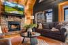 Cozy living room with fireplace, TV, & unforgettable views Cozy living room with fireplace, TV, & unforgettable views