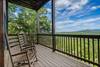 Rocking chairs facing breathtaking mountain scenery Rocking chairs facing breathtaking mountain scenery