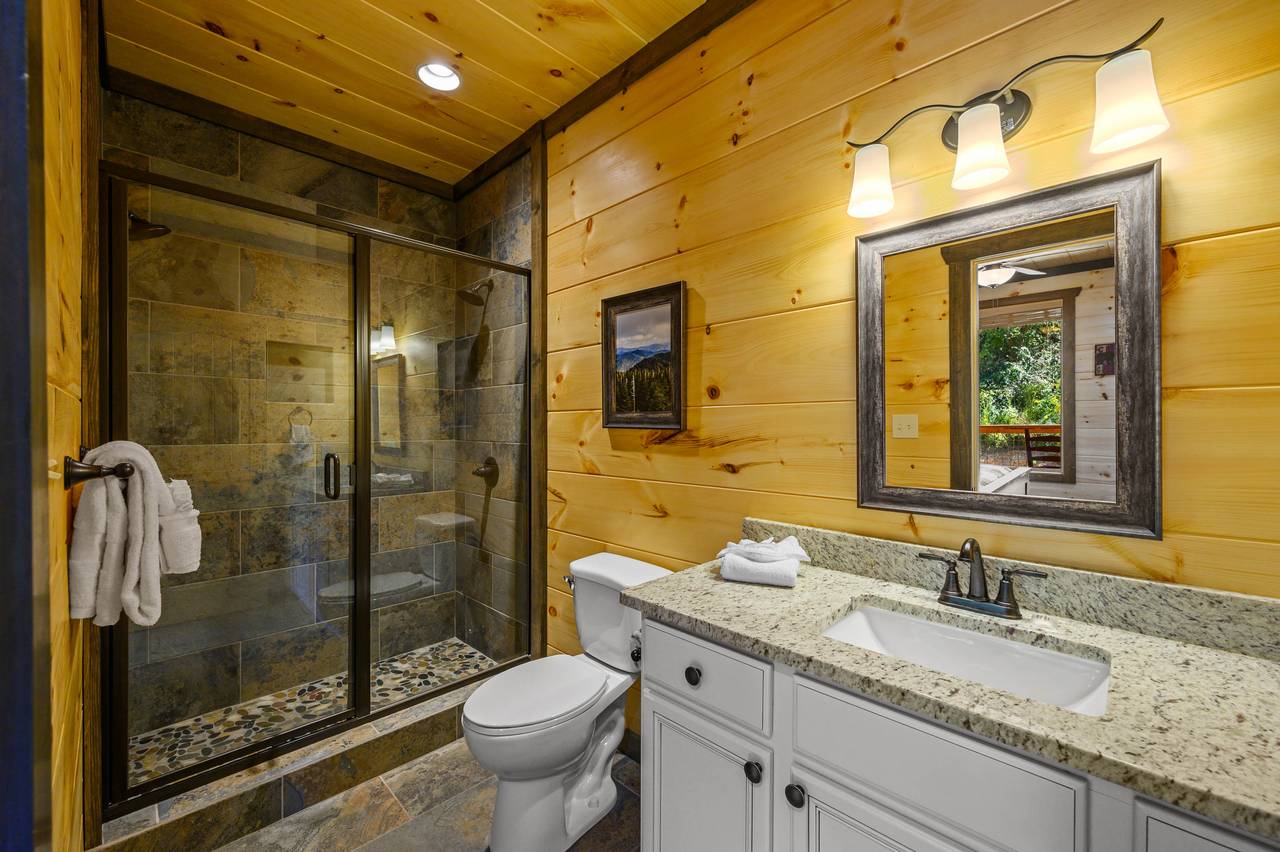 Main Level Ensuite Full Bathroom with Vertical Shower Main Level Ensuite Full Bathroom with Vertical Shower