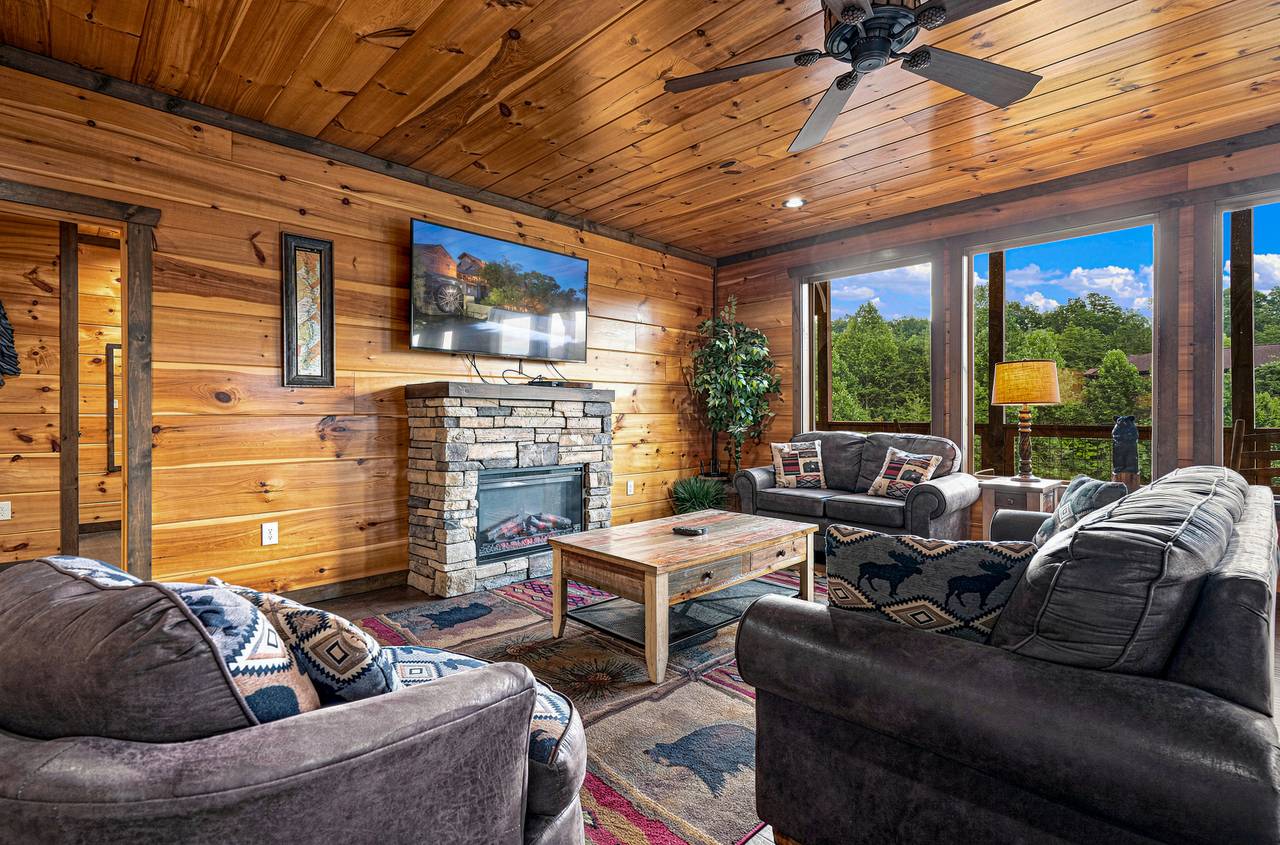 Main living room with electric fireplace and flat-screen TV. Main living room with electric fireplace and flat-screen TV.