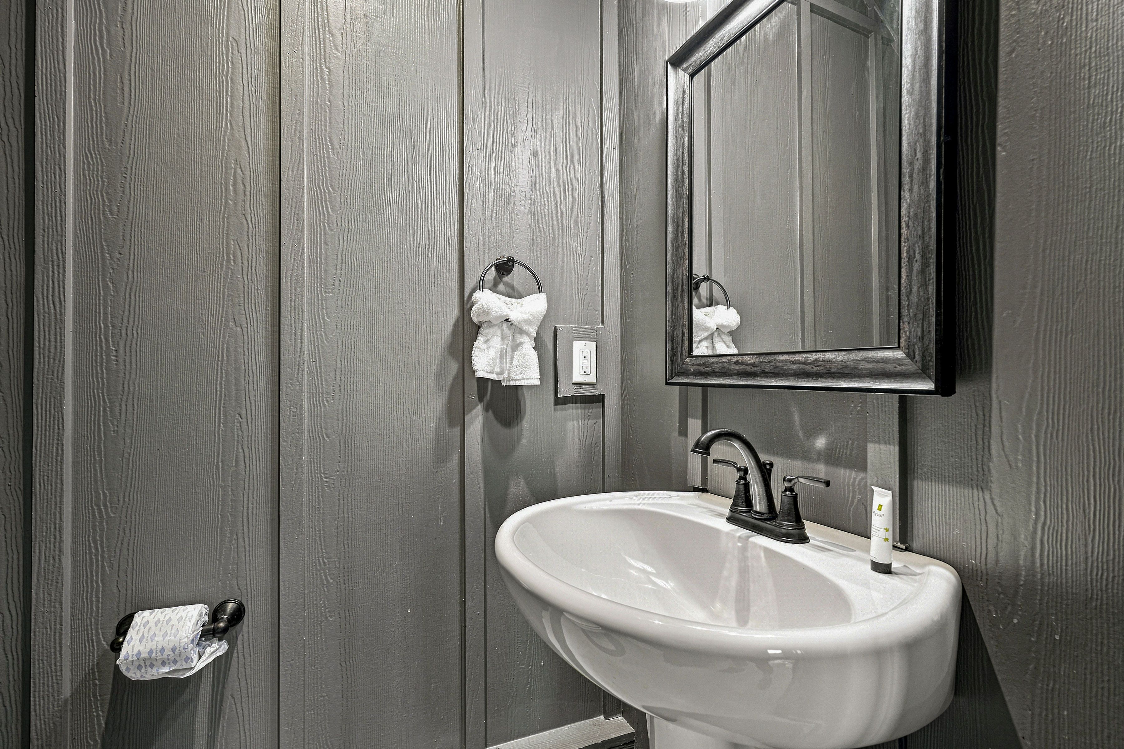Half bathroom is conveniently located near the pool.