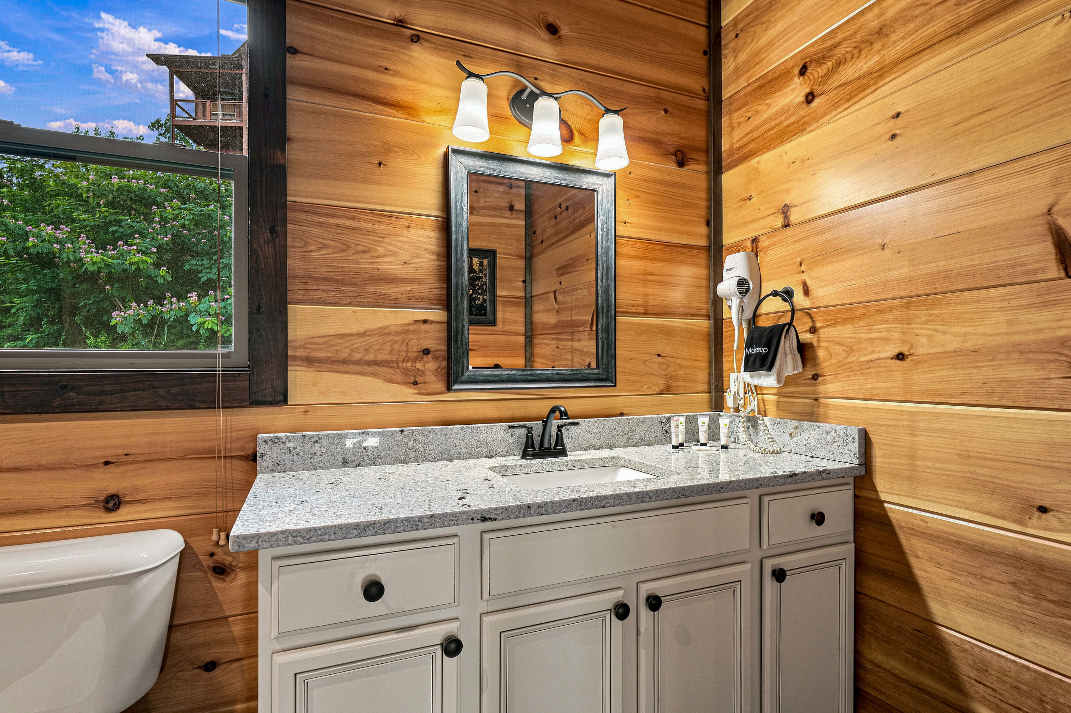 En-suite bathroom features a tub and shower combination.