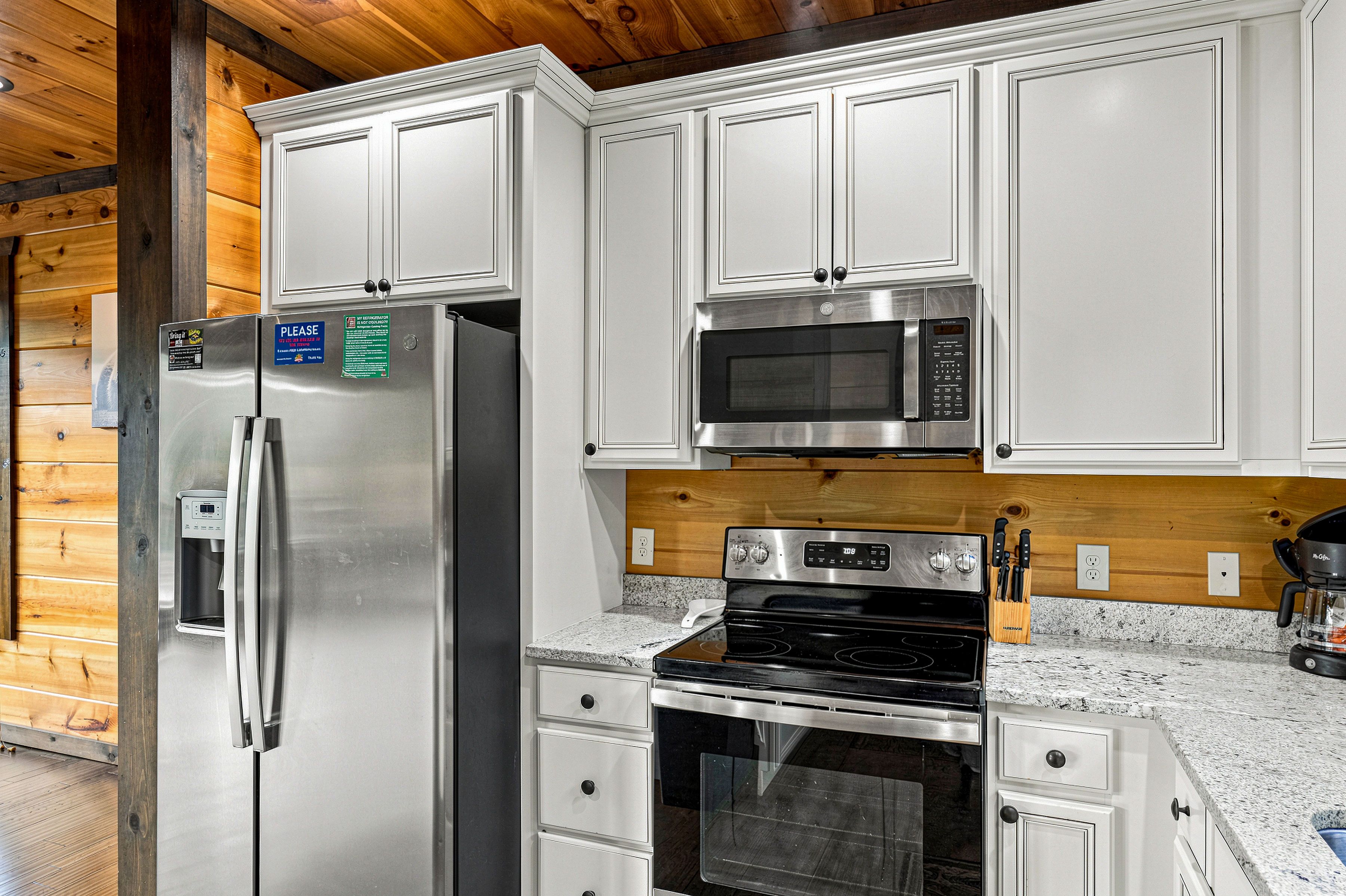 Kitchen includes cookware, dinnerware, cutlery, & bakeware.