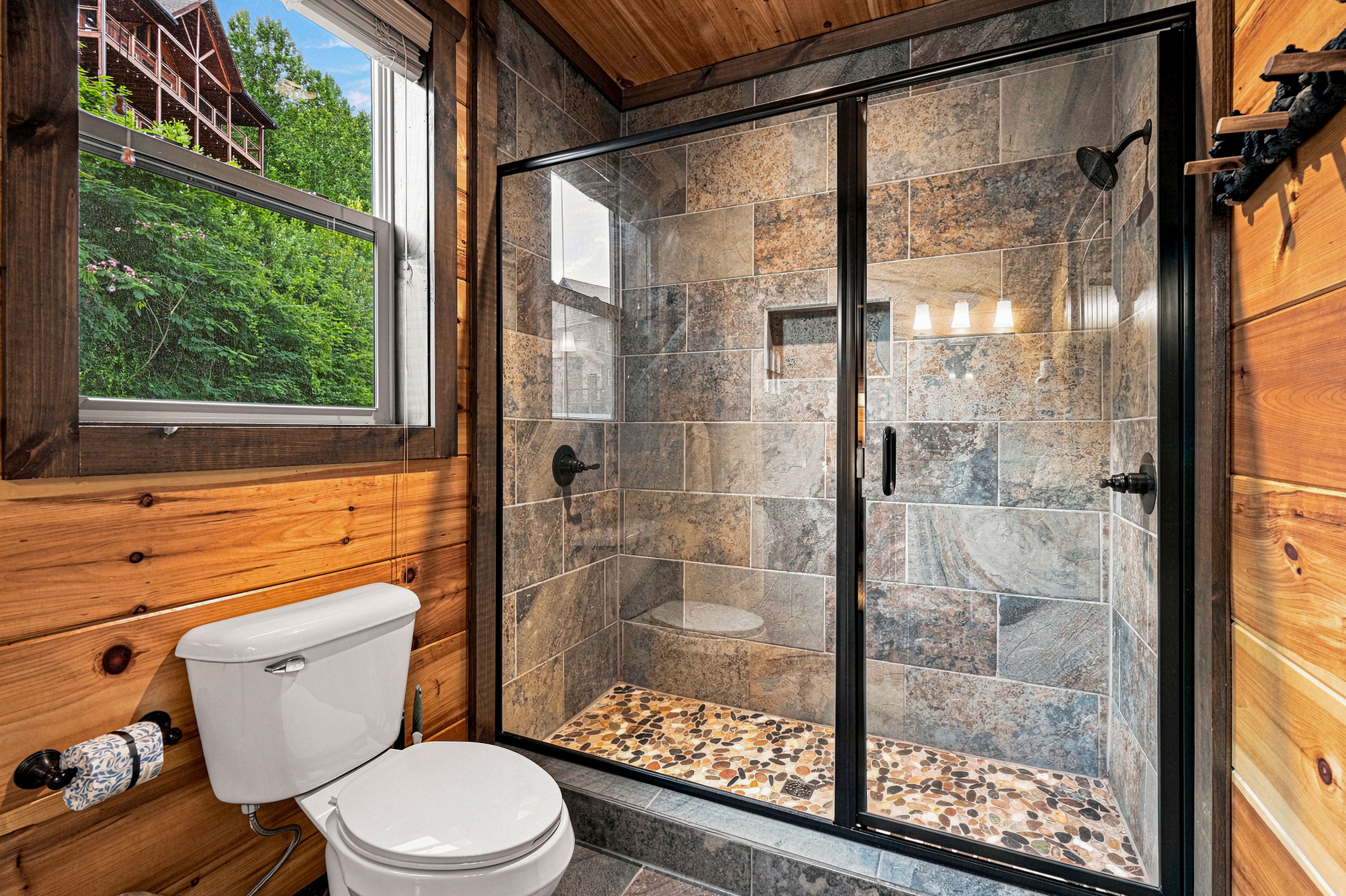Walk-in shower spa with dual showerheads.