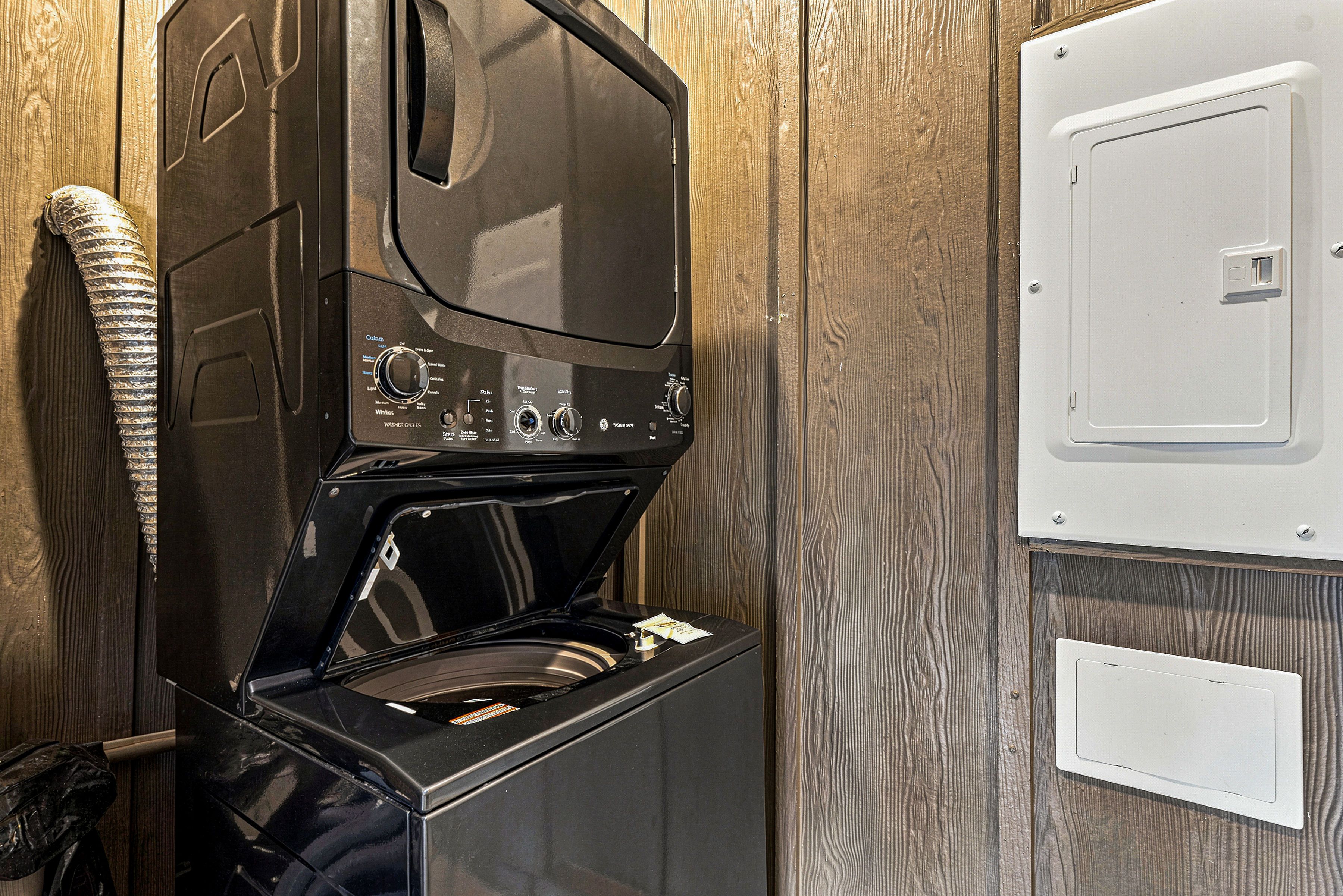 Stackable washer and dryer provided for guest use.