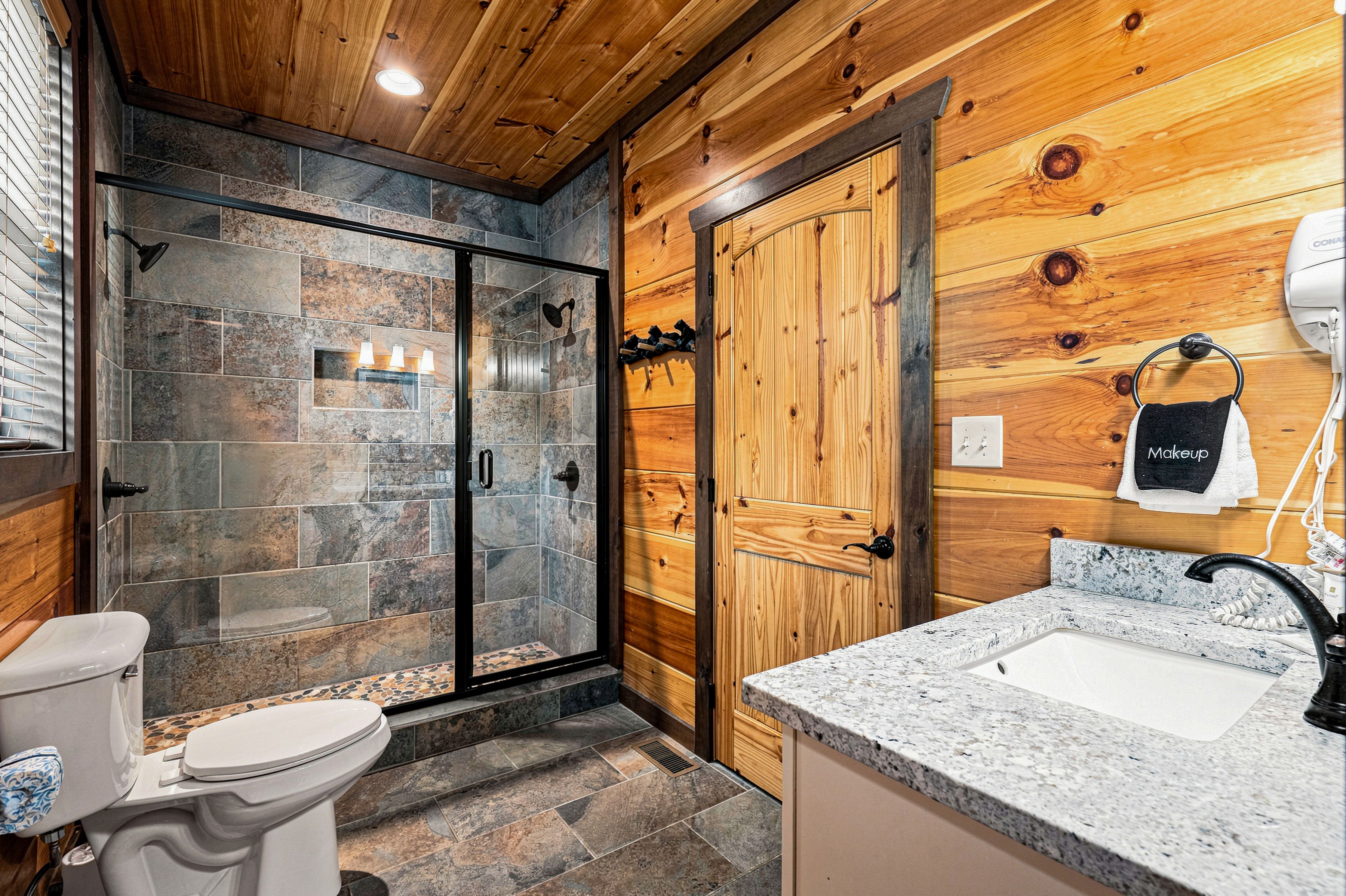 Walk-in shower spa with dual showerheads.