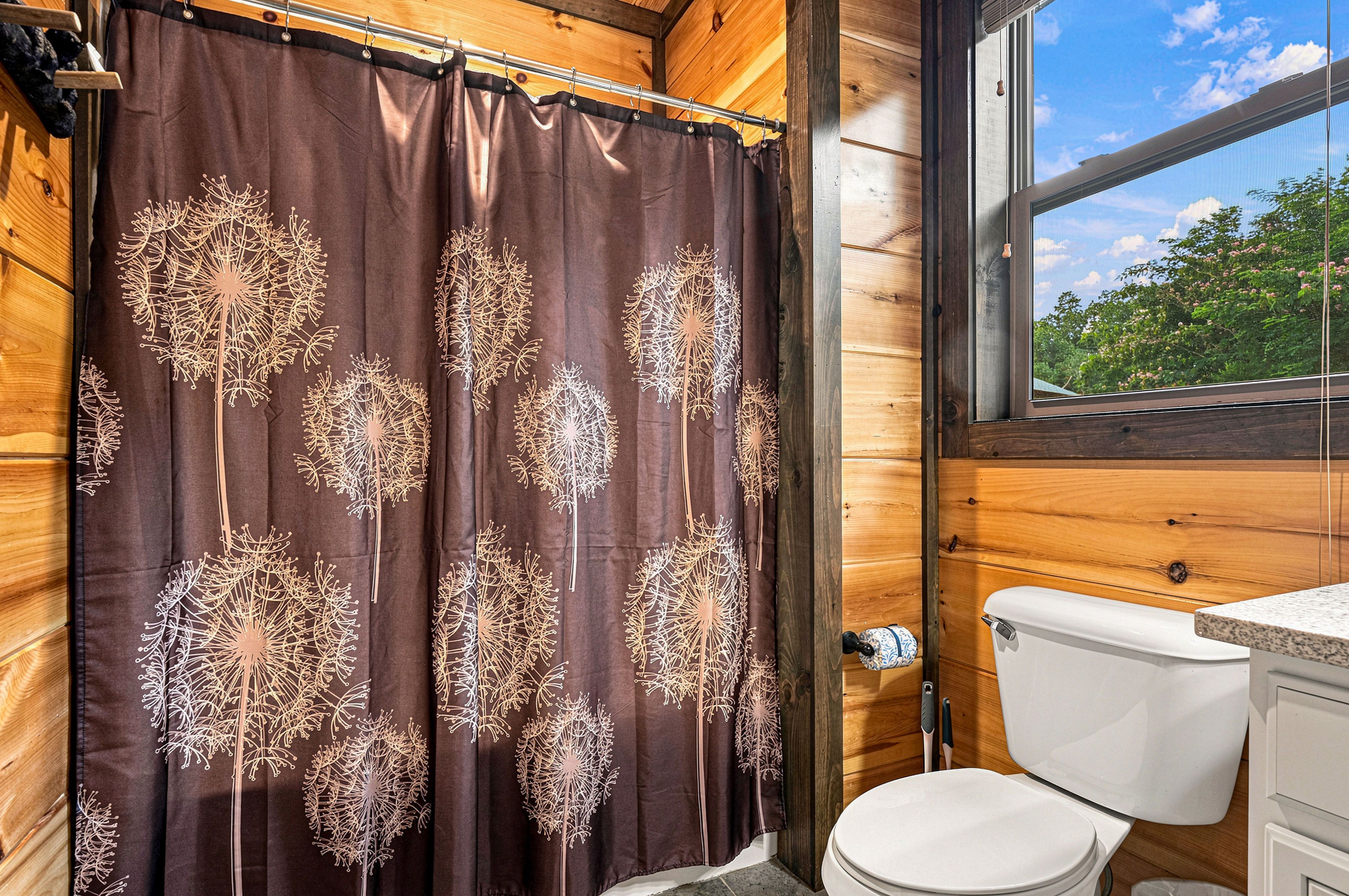 En-suite bathroom features a tub and shower combination.