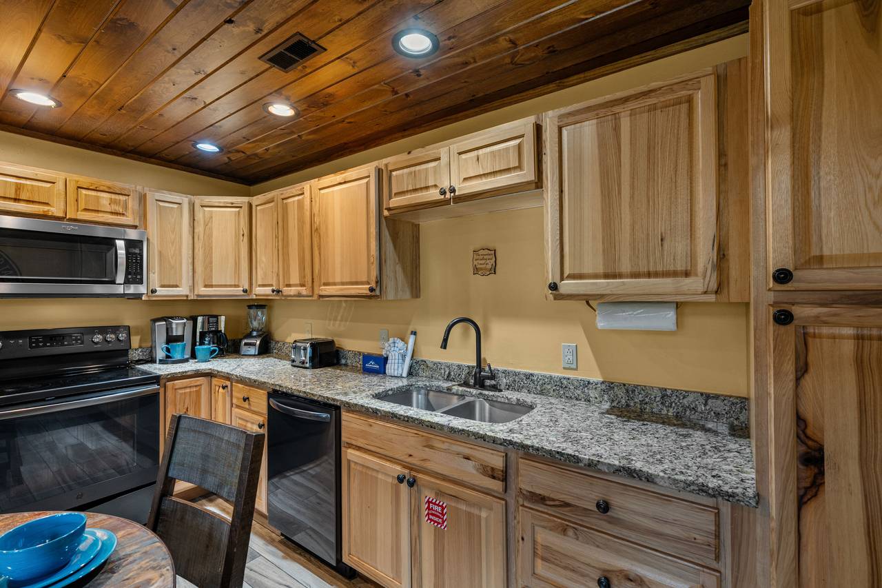 Spacious kitchen w/ smooth cooktop & large fridge Spacious kitchen w/ smooth cooktop & large fridge