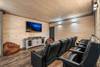 Cozy Theater Room with Tiered Seating & Big Screen Cozy Theater Room with Tiered Seating & Big Screen