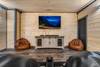 Cozy Theater Room with Tiered Seating & Big Screen Cozy Theater Room with Tiered Seating & Big Screen