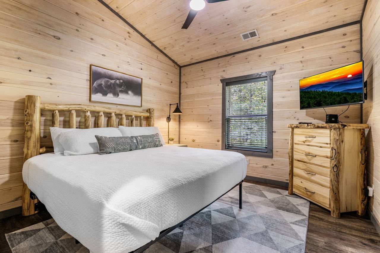 King Bedroom with HDTV & Shared Bath Access King Bedroom with HDTV & Shared Bath Access