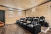 Cozy Theater Room with Tiered Seating & Big Screen Cozy Theater Room with Tiered Seating & Big Screen
