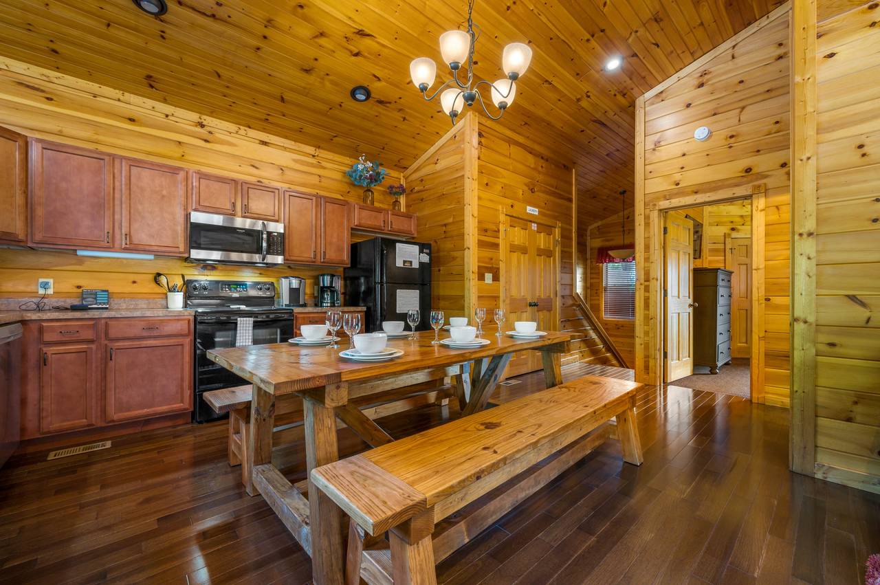 Dining area with custom wood table with benches. Dining area with custom wood table with benches.