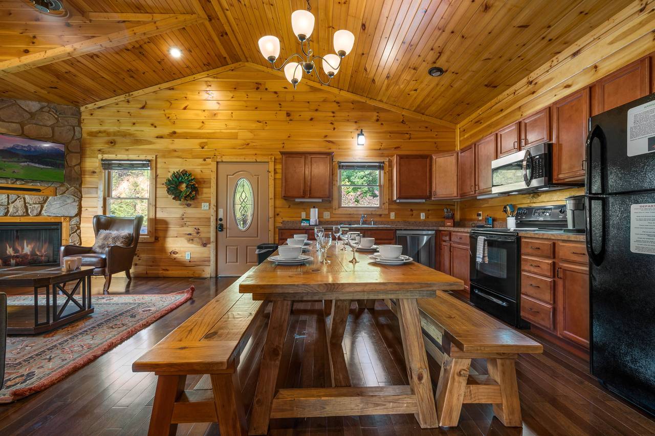 Dining area with custom wood table with benches. Dining area with custom wood table with benches.