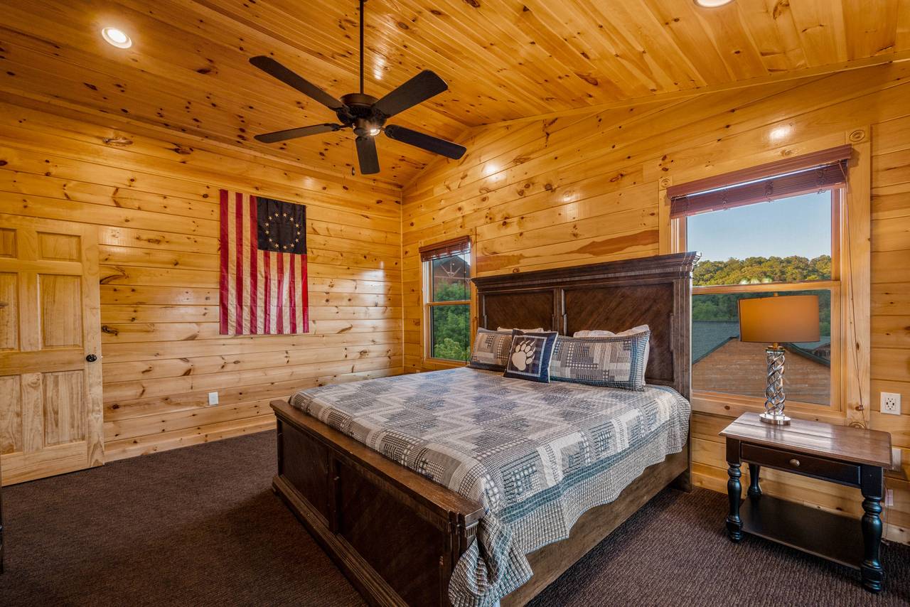 Bed 3: King bed, deck entrance, TV, and ensuite full bath Bed 3: King bed, deck entrance, TV, and ensuite full bath