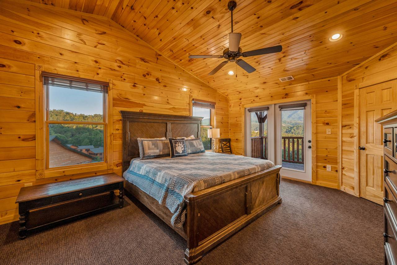 Bed 3: King bed, deck entrance, TV, and ensuite full bath Bed 3: King bed, deck entrance, TV, and ensuite full bath