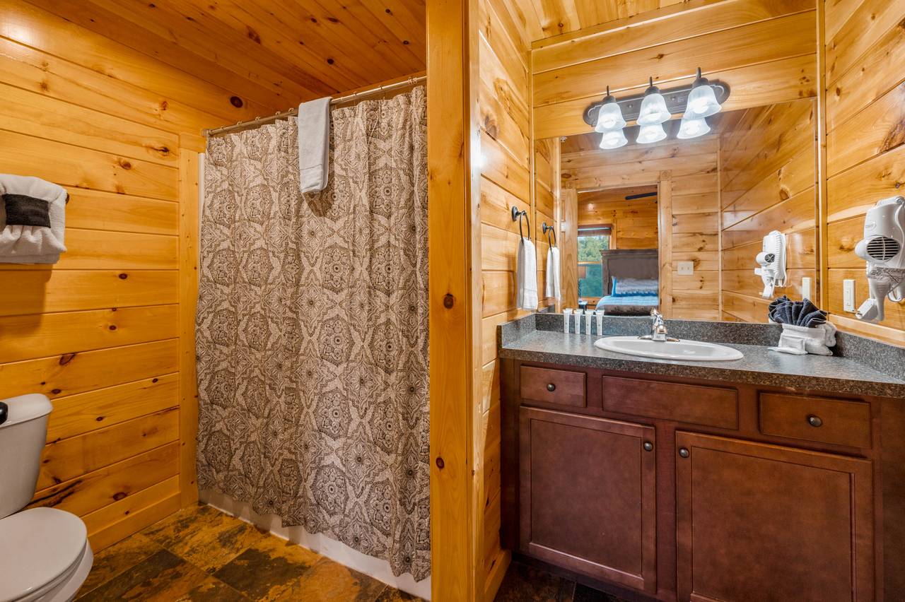 Bed 3: ensuite full bathroom with tub shower combo Bed 3: ensuite full bathroom with tub shower combo