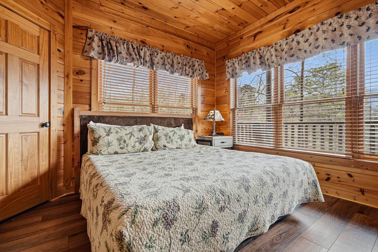 Lower-level king bedroom with fireplace, TV, & ensuite full bath Lower-level king bedroom with fireplace, TV, & ensuite full bath