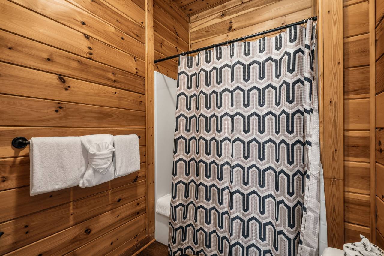 Lower-level full bath with tub and shower combo & hair dryer Lower-level full bath with tub and shower combo & hair dryer