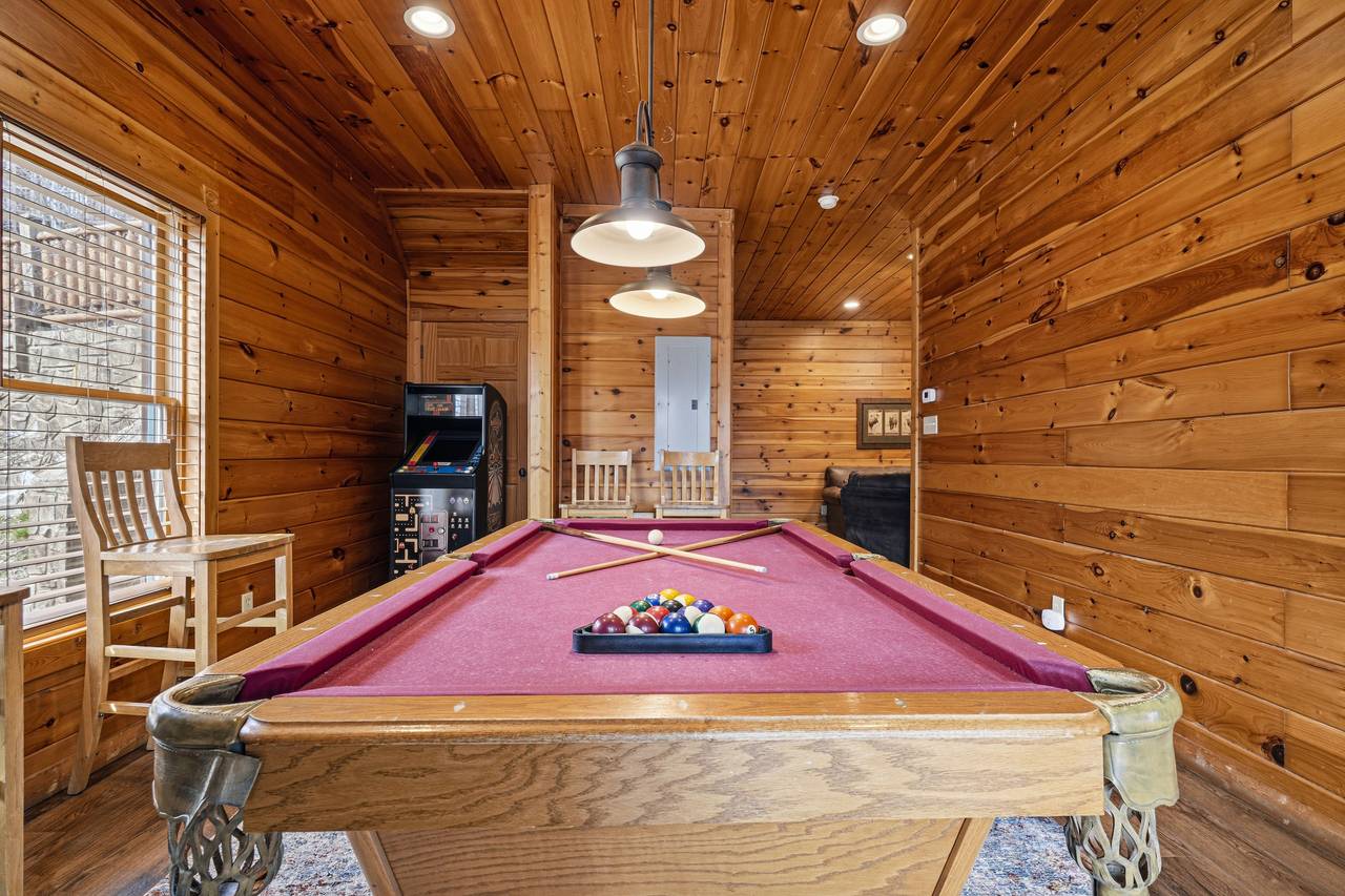 Game room with pool table, foosball & multi-cade arcade Game room with pool table, foosball & multi-cade arcade