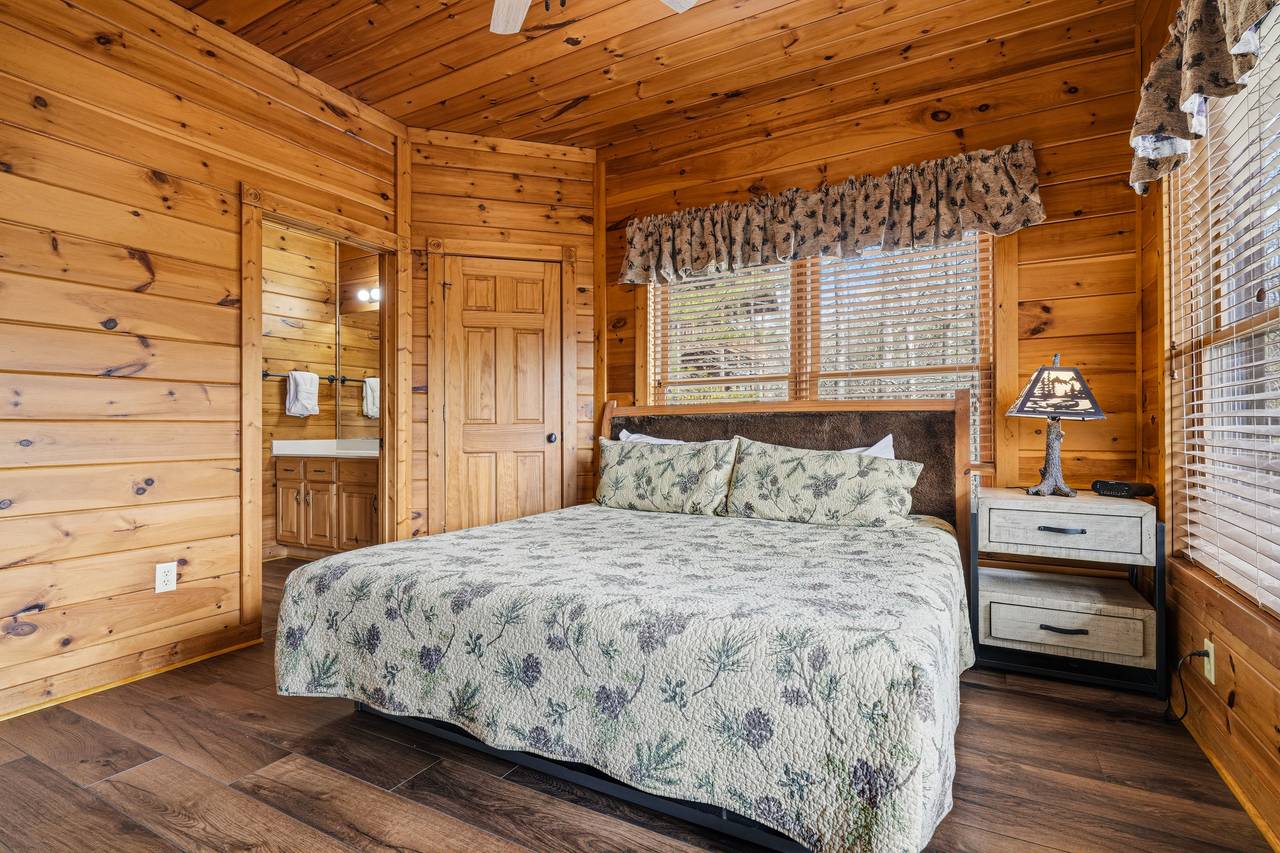 Lower-level king bedroom with fireplace, TV, & ensuite full bath Lower-level king bedroom with fireplace, TV, & ensuite full bath