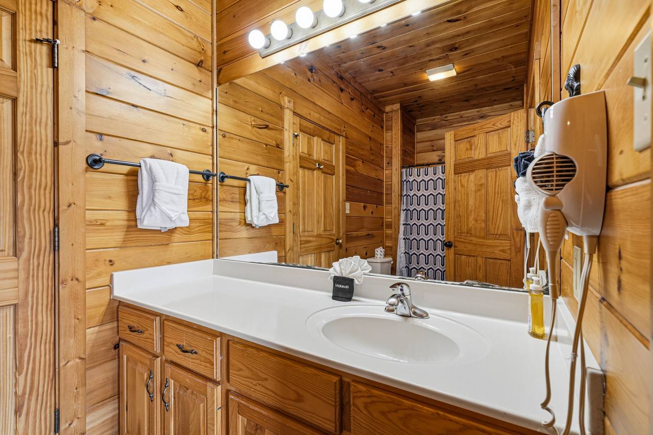 Lower-level full bath with tub and shower combo & hair dryer Lower-level full bath with tub and shower combo & hair dryer
