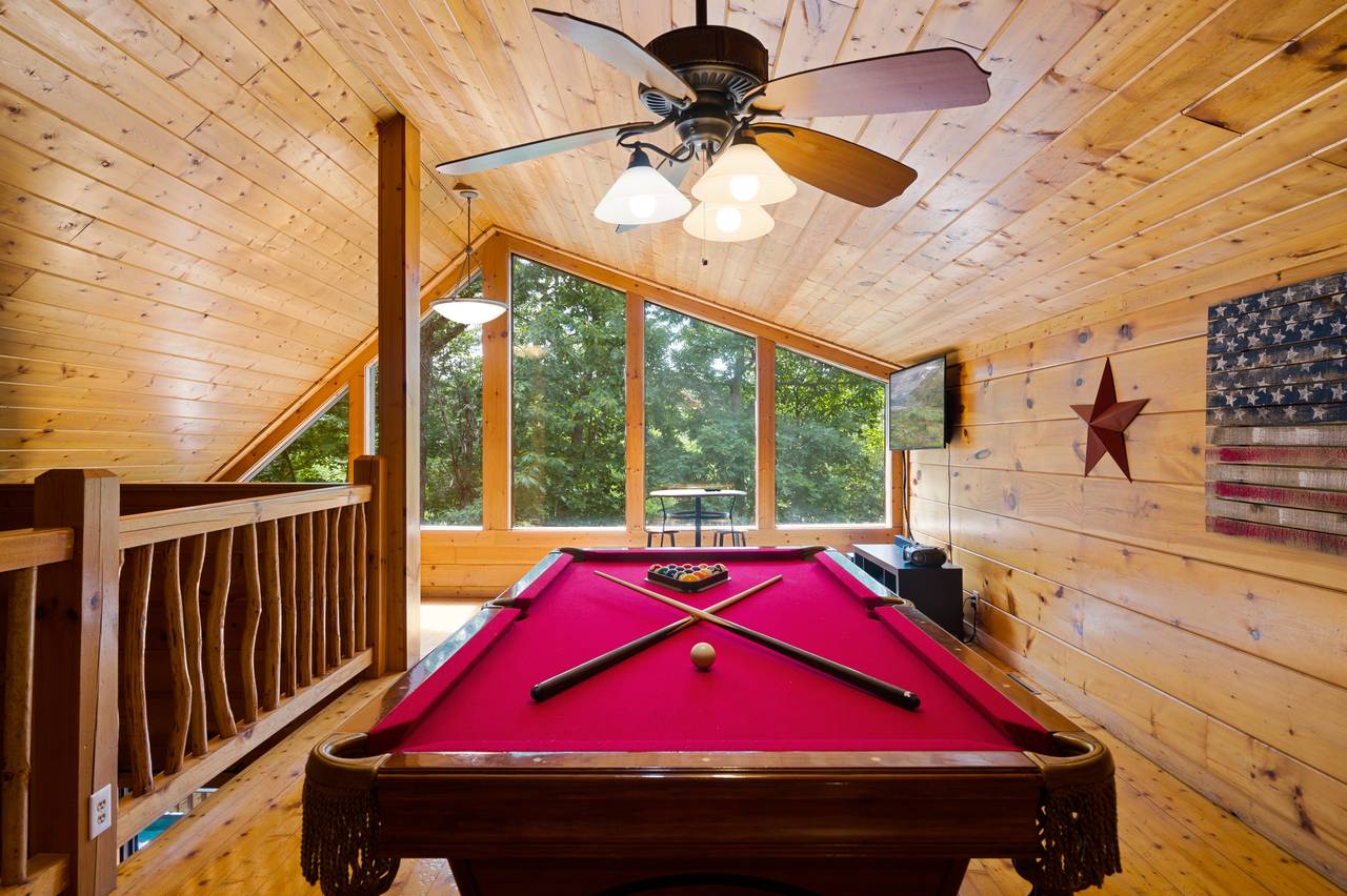Loft game room with pool table and multi-cade Loft game room with pool table and multi-cade