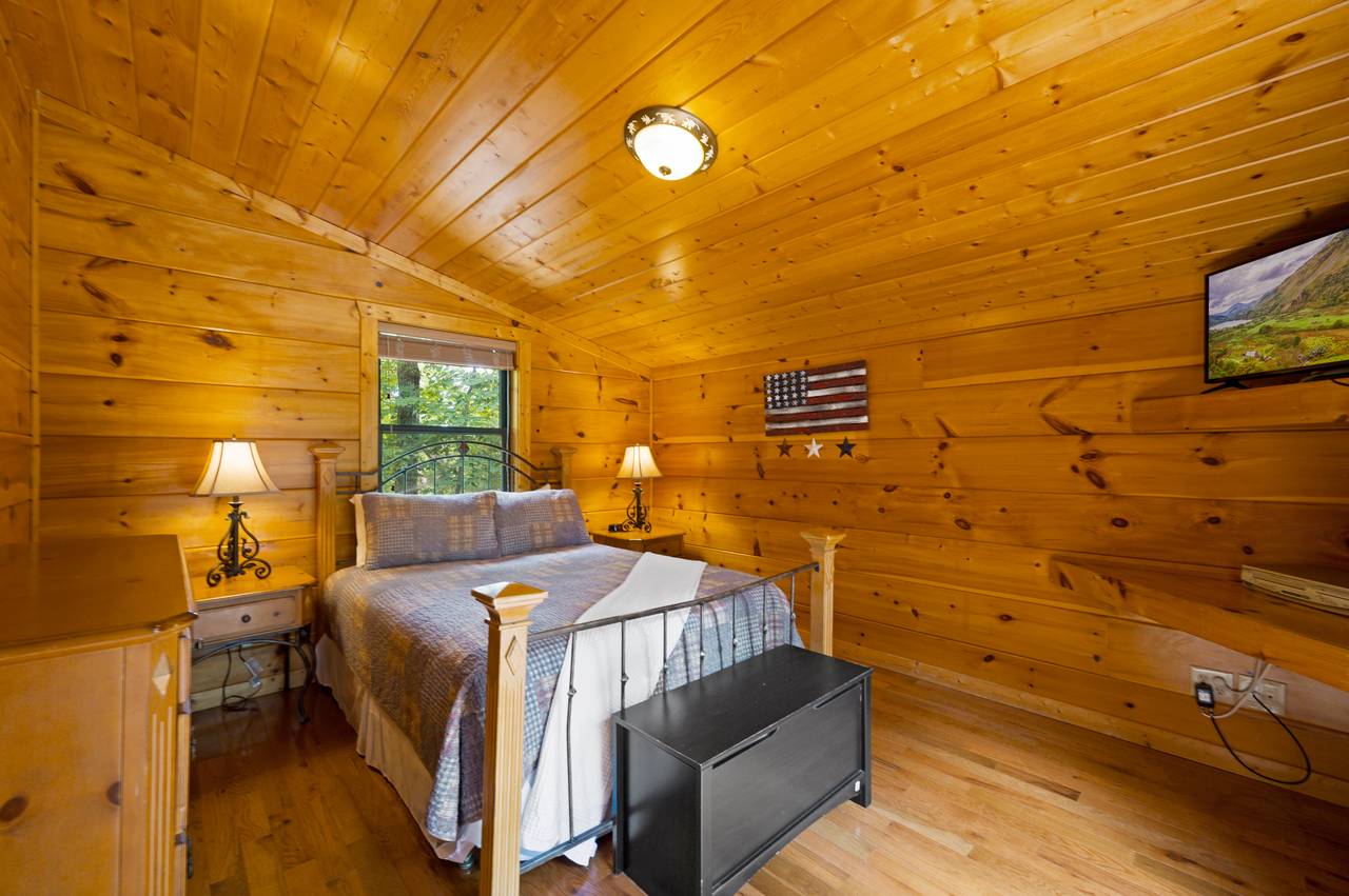Bed 2: Queen bed with TV and deck entrance on main level Bed 2: Queen bed with TV and deck entrance on main level
