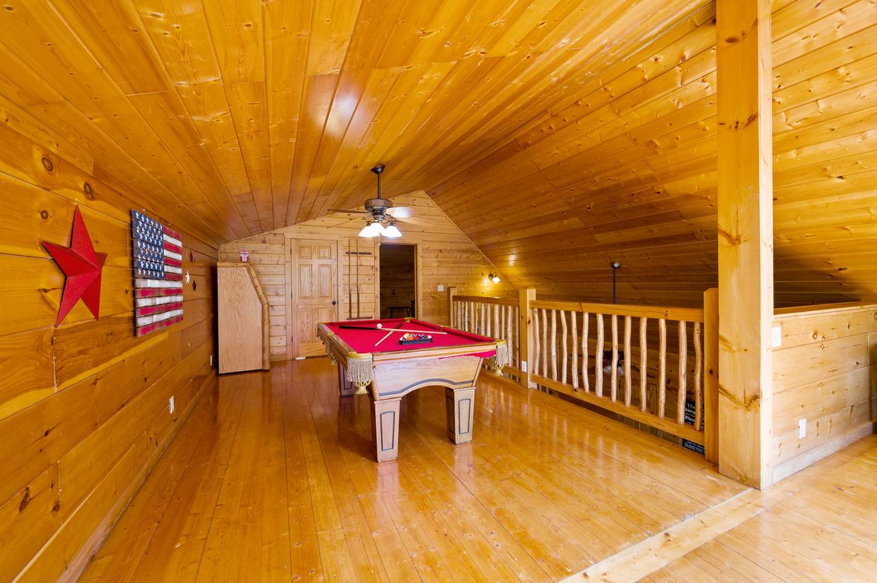 Loft game room with pool table and multi-cade Loft game room with pool table and multi-cade