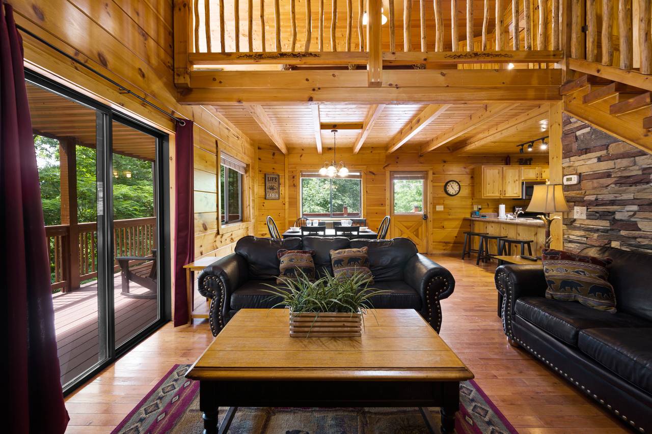 Spacious living room offers fireplace, TV, and sleeper sofa Spacious living room offers fireplace, TV, and sleeper sofa