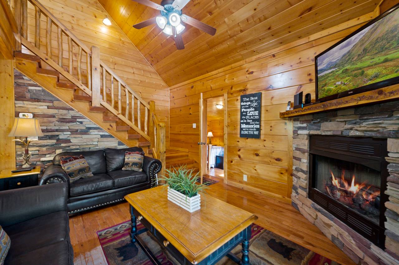 Spacious living room with sofa, loveseat, fireplace, and TV Spacious living room with sofa, loveseat, fireplace, and TV
