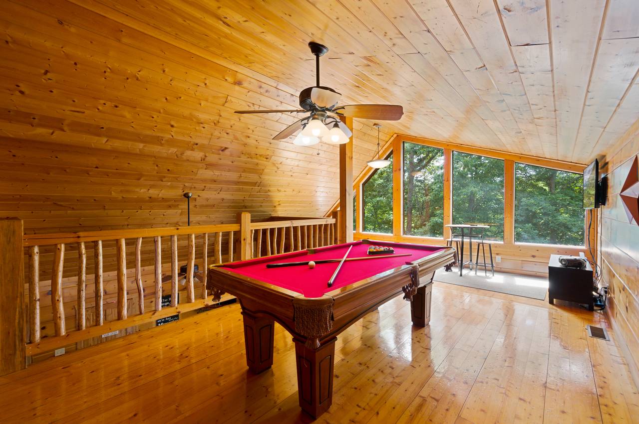 Loft game room with pool table and multi-cade Loft game room with pool table and multi-cade
