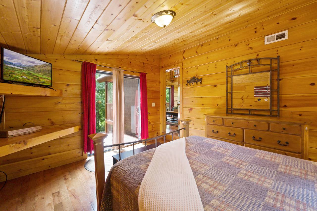Bed 2: Queen bed with TV and deck entrance on main level Bed 2: Queen bed with TV and deck entrance on main level