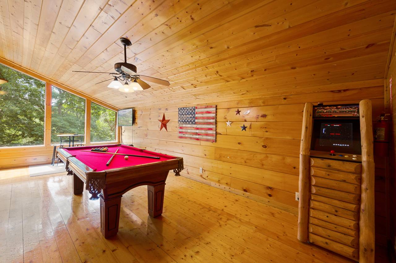 Loft game room with pool table and multi-cade Loft game room with pool table and multi-cade