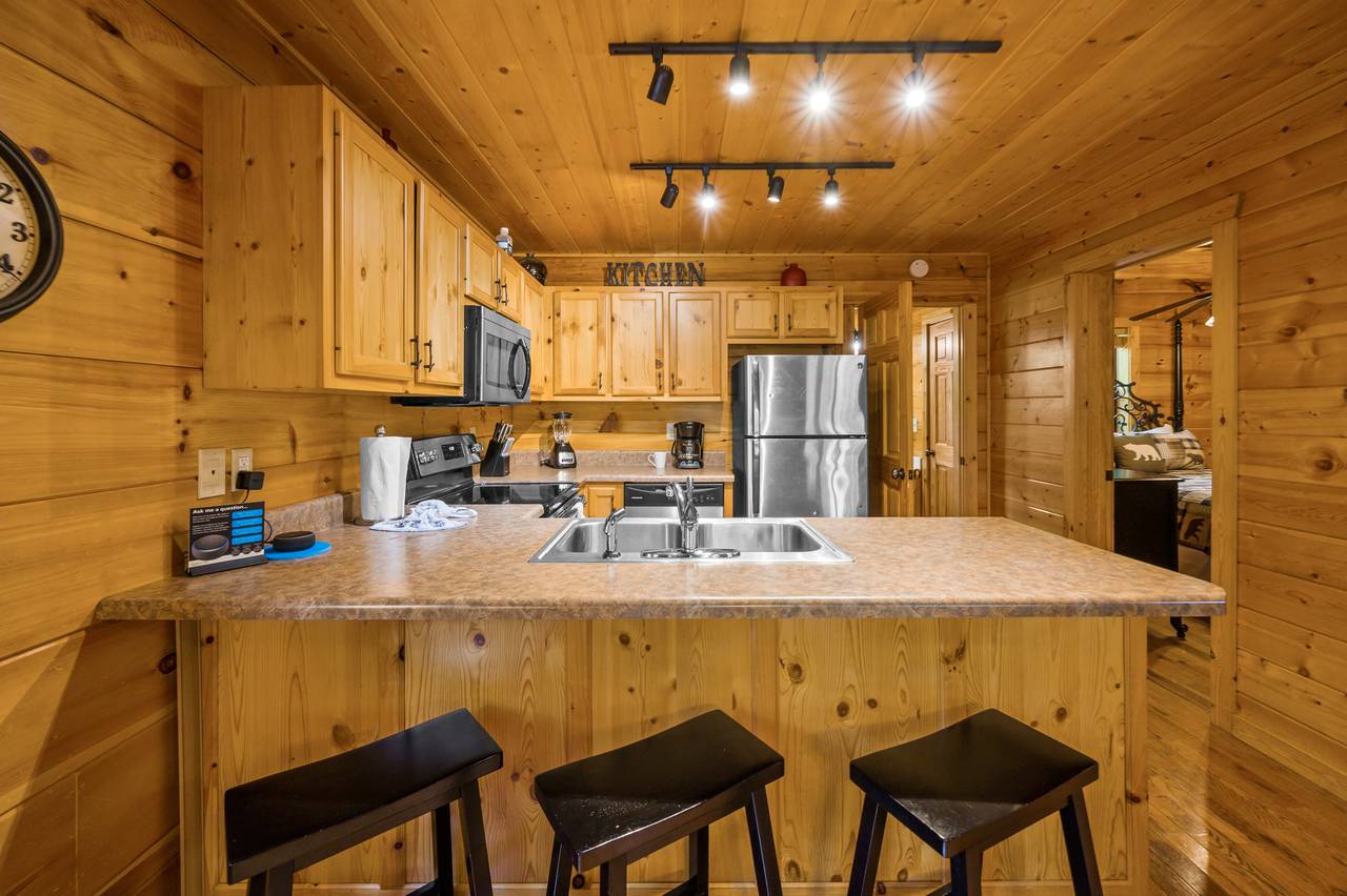 Fully equipped kitchen and additional dining seats Fully equipped kitchen and additional dining seats