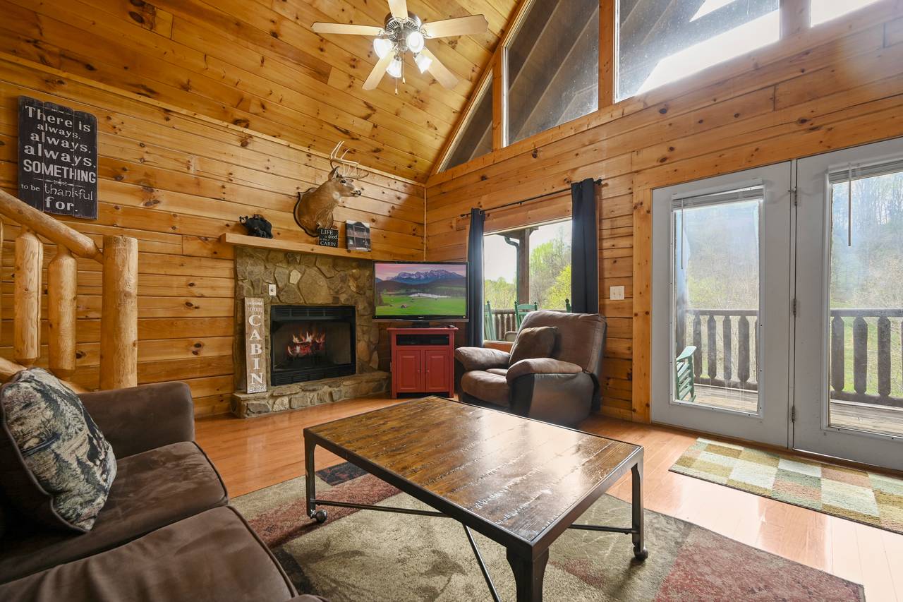 <span class="name">Living room with flat screen TV and fireplace</span> <span class="name">Living room with flat screen TV and fireplace</span>