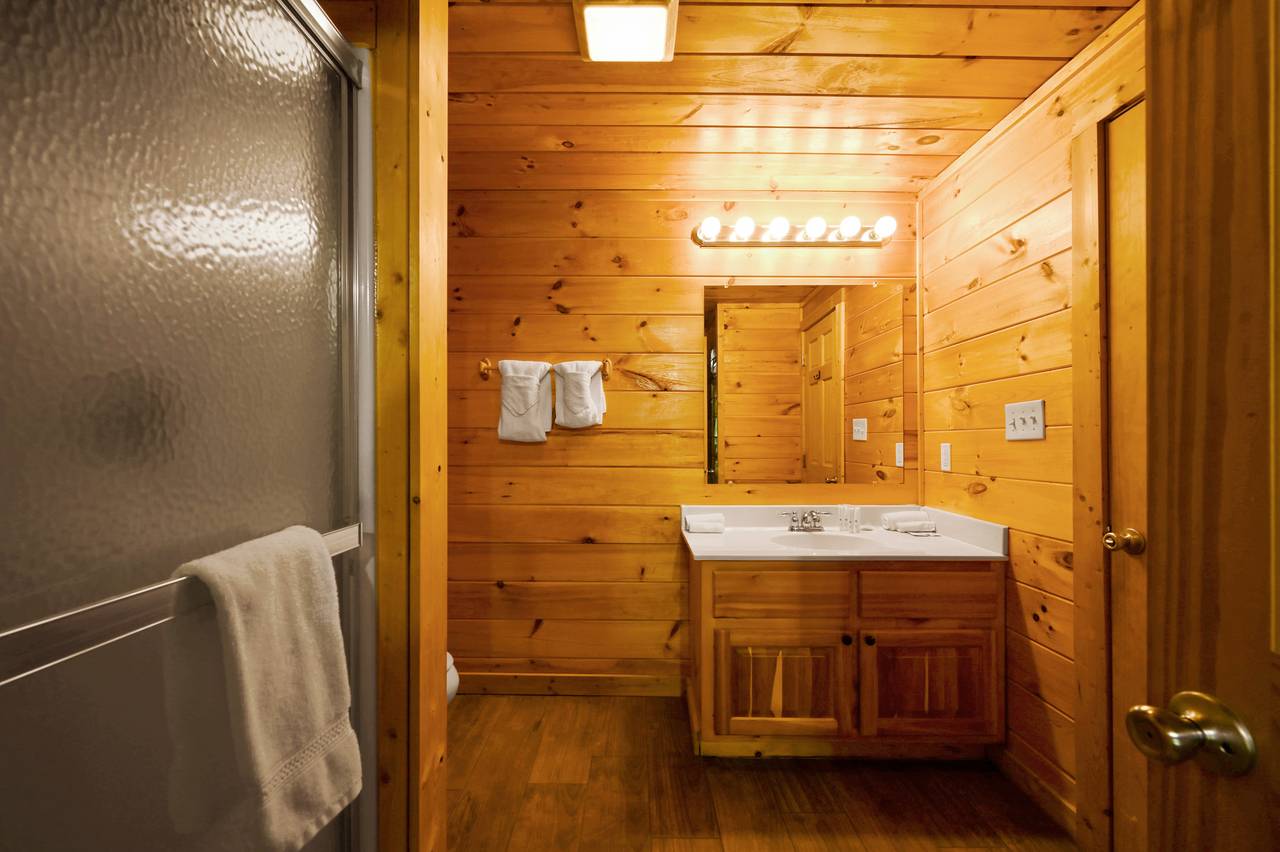 <span class="name">Main level ensuite bathroom with standing shower.</span> <span class="name">Main level ensuite bathroom with standing shower.</span>