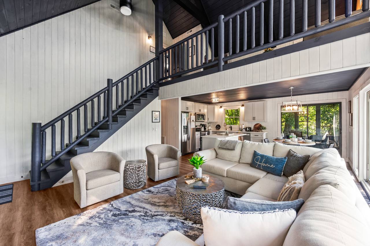 Living room with stone fireplace & views Living room with stone fireplace & views
