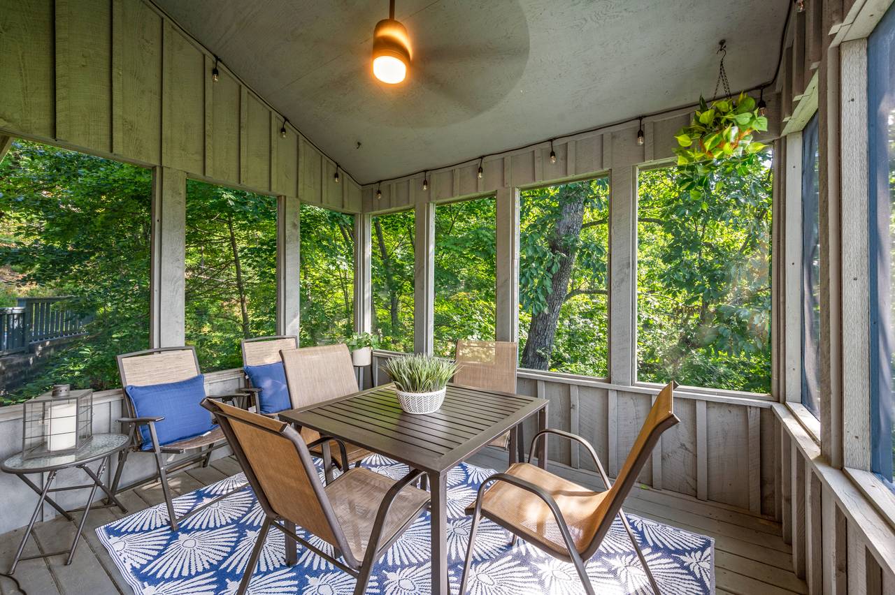 Screened porch with relaxing seating Screened porch with relaxing seating