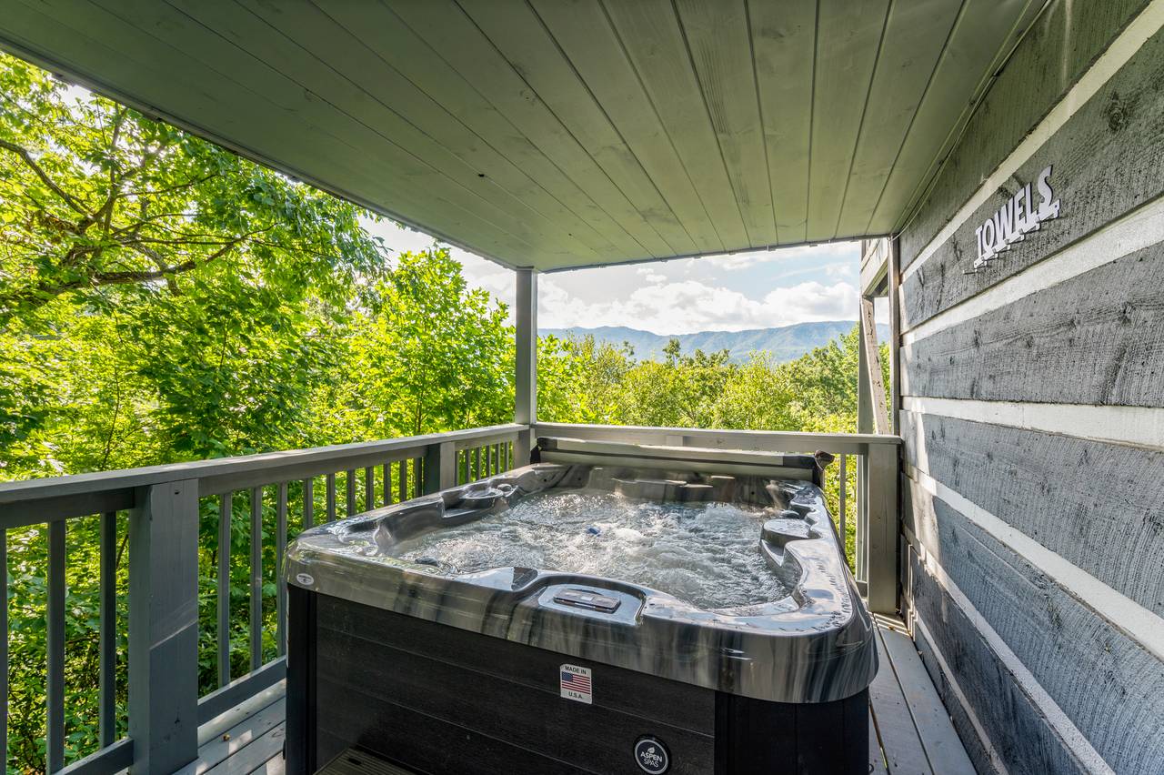Private hot tub with mountain backdrop Private hot tub with mountain backdrop