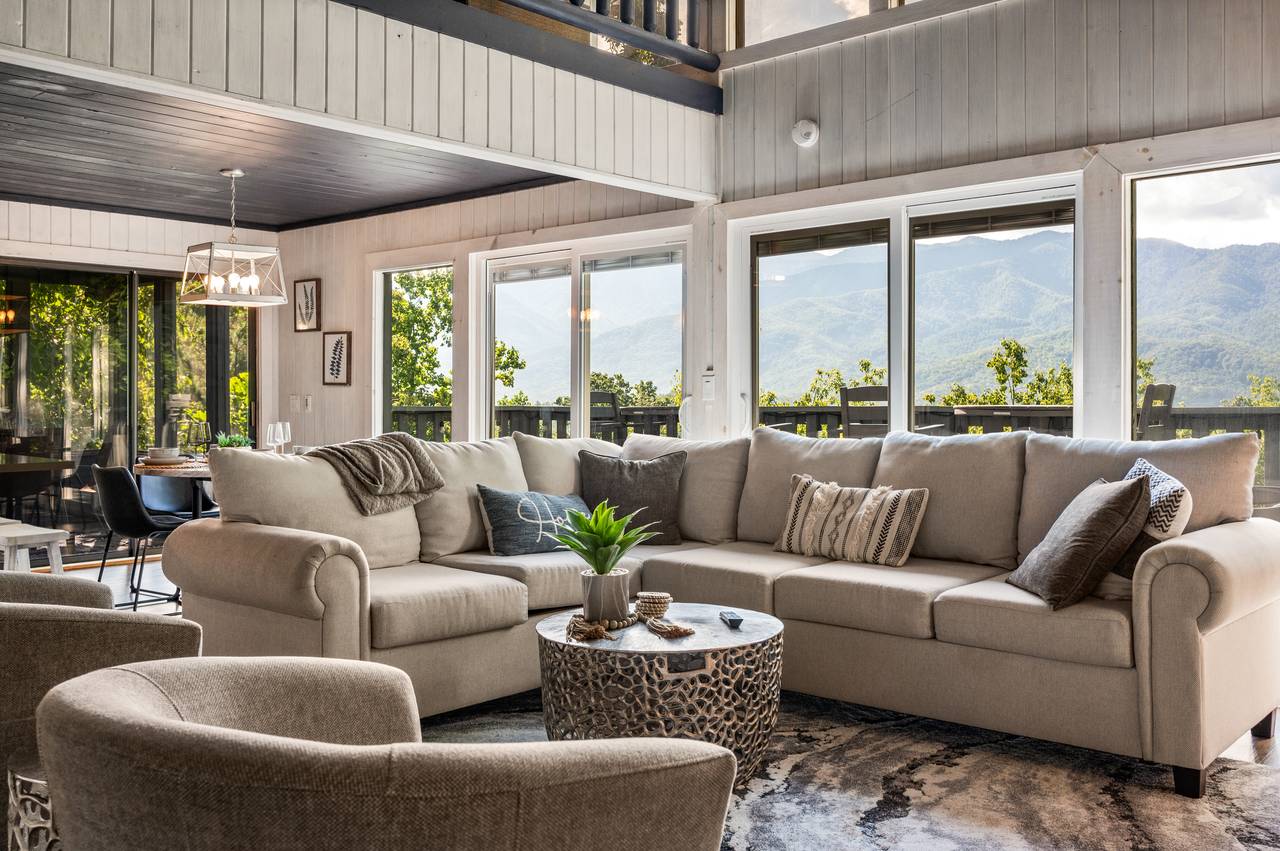 Living room with stone fireplace & views Living room with stone fireplace & views