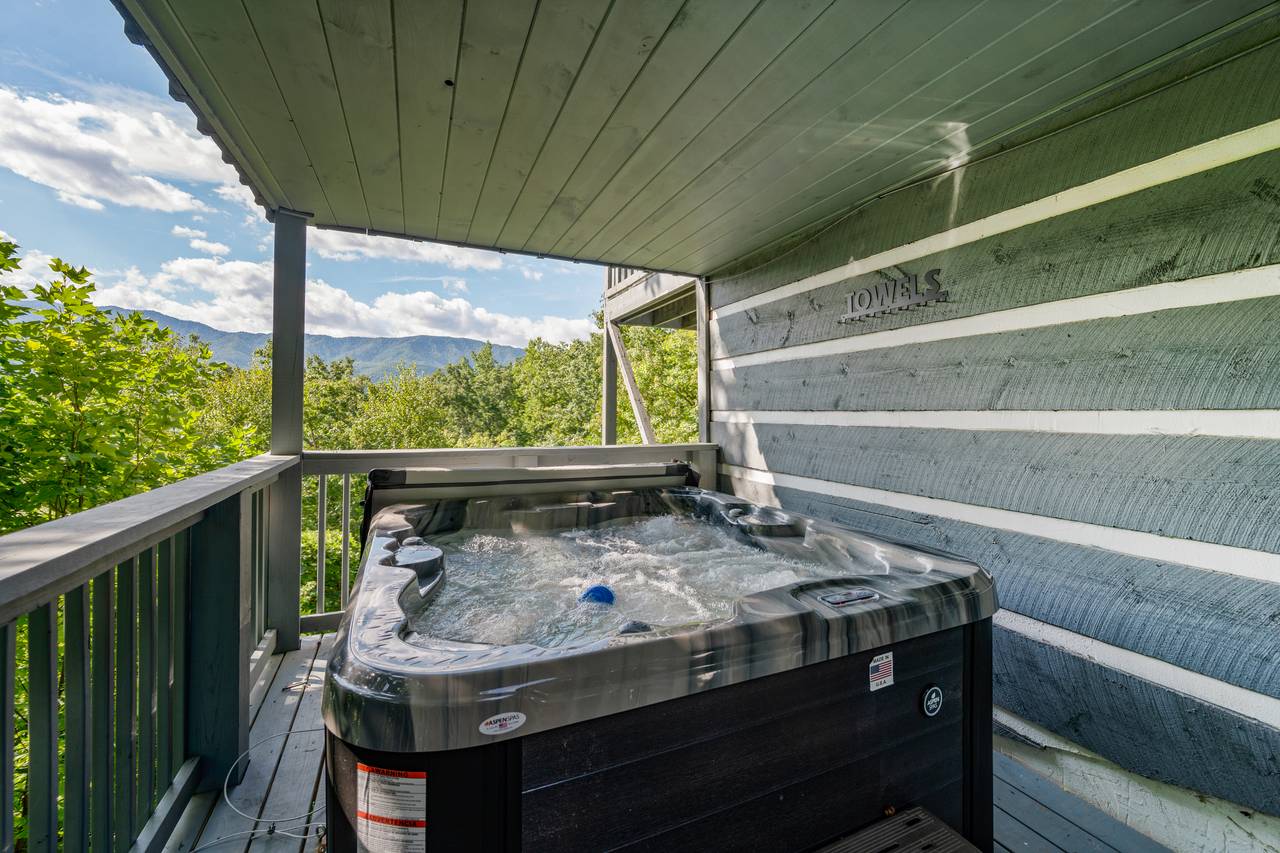 Private hot tub with mountain backdrop Private hot tub with mountain backdrop