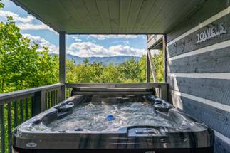 Private hot tub with mountain backdrop Private hot tub with mountain backdrop