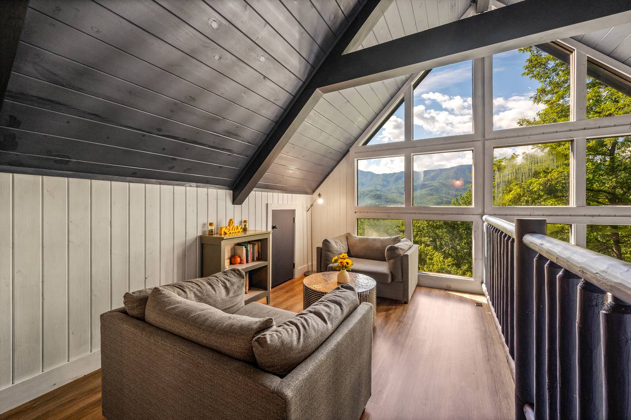 Cozy reading nook with floor-to-ceiling windows Cozy reading nook with floor-to-ceiling windows